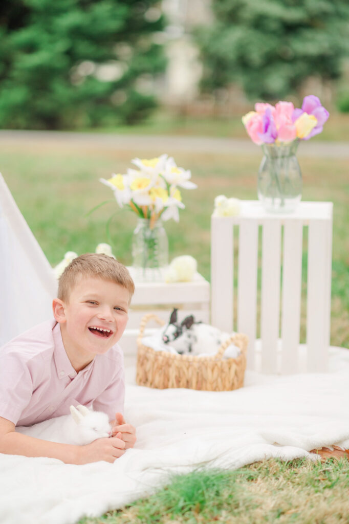 Boy laughing during spring family photos in Wilmington Delaware