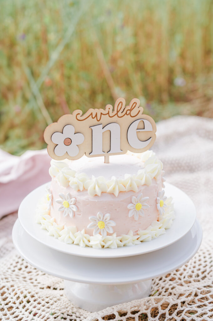 Baby's first birthday milestone session. Photographs of baby eating their smash cake